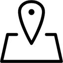 A simple stylized icon of a map with a map marker hovering over it.